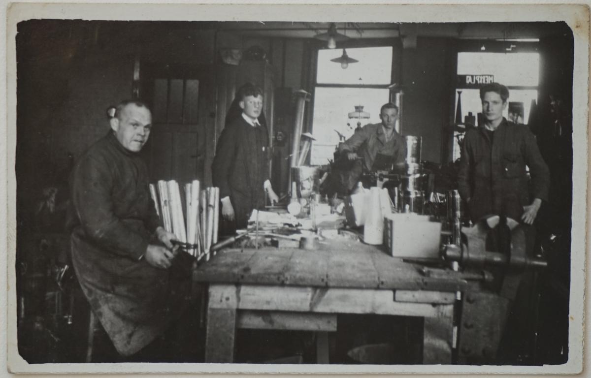 Founding father and employees working in the workshop